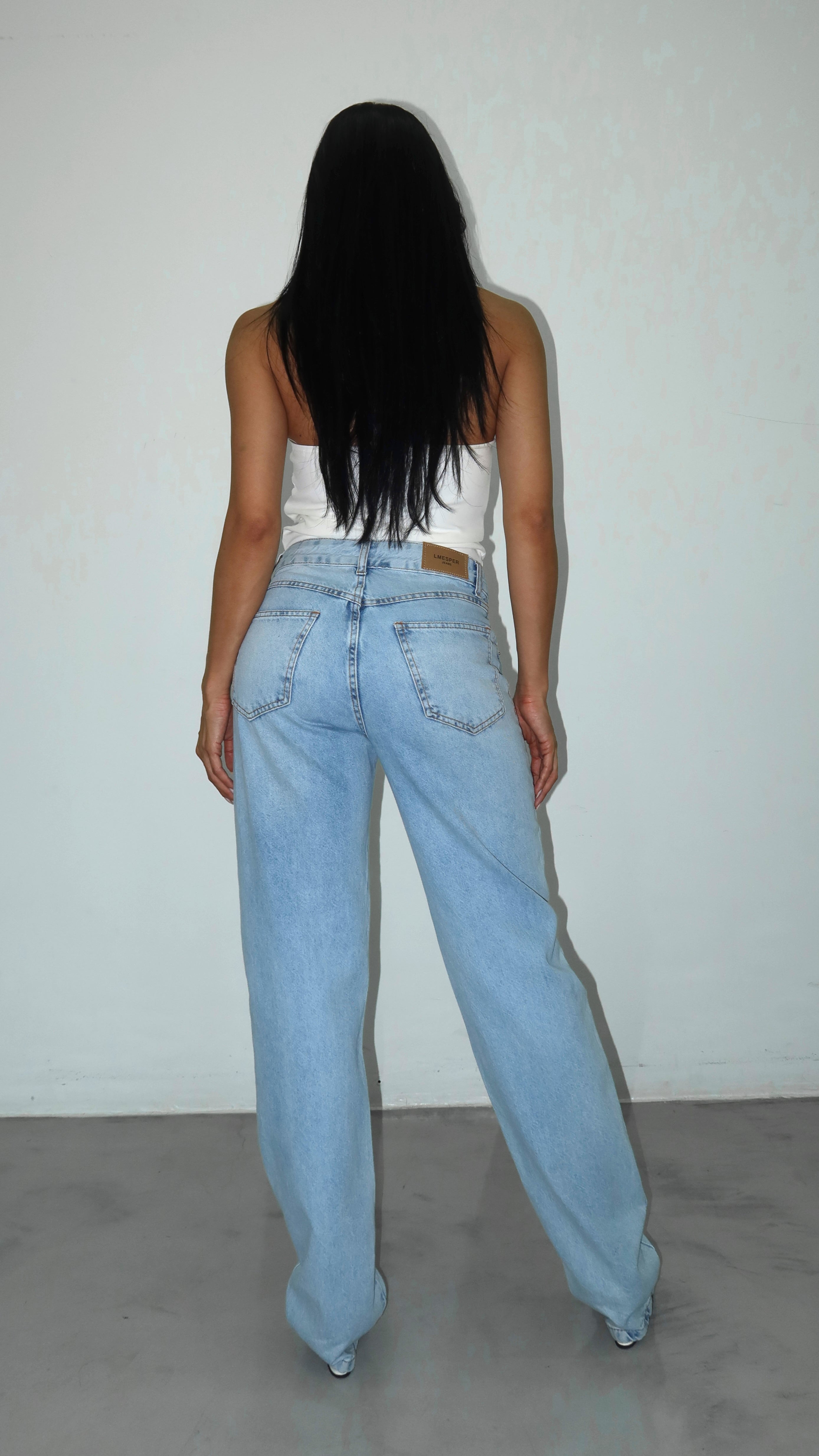 CALÇA JEANS ASSIMÉTRICA